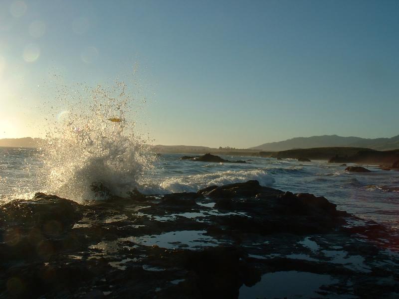 Water crashing over rocks on the coast.