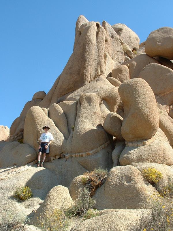 Rob climbs up some rocks in The Joshua Tree National Park