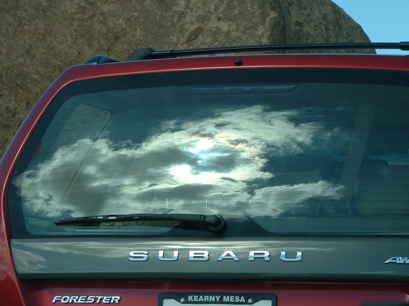 The sun behind some clouds at The Joshua Tree National Park