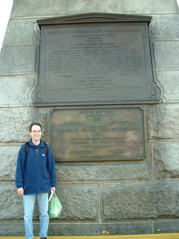 Rob with the Brooklyn Bridge plaque, and lunch, New York City